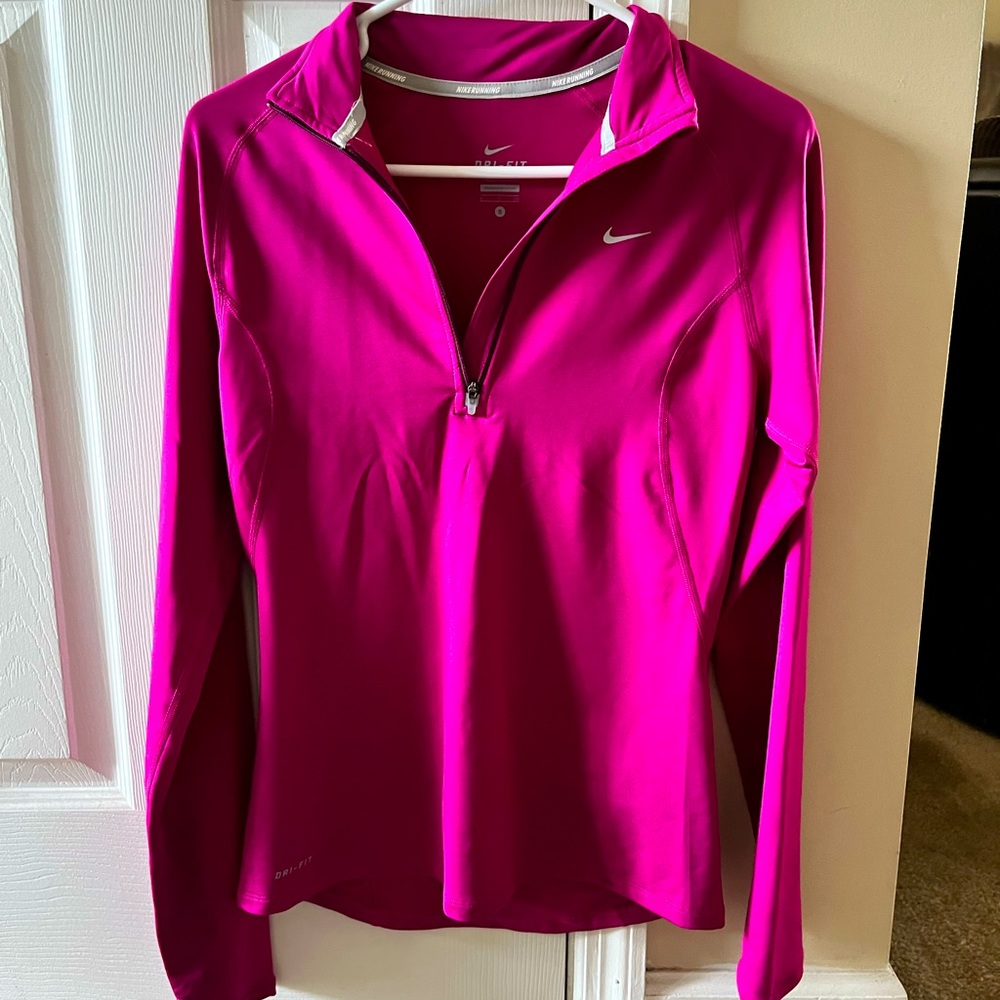 Nike DriFit woman’s long sleeve jogger. Half zip.